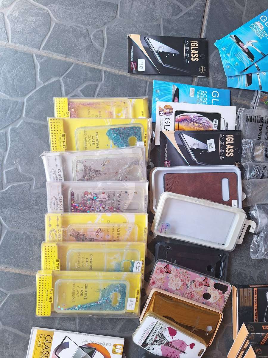 Bulk load of cellphone covers and screne protectors. 64 pieces