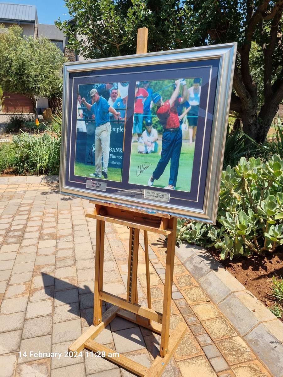 *****ORIGINAL SIGNED AND GLASS FRAMED PHOTO OF SA GOLF LEGENDS - ERNIE ELS AND RETIEF GOOSEN*****