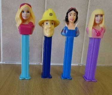 FOUR DISNEY PEZ DISPENSERS: FIREMAN SAM, 2X BARBIE'S  AND SNOWWHITE