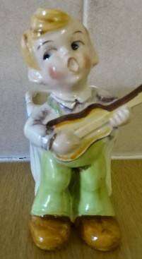 CERAMIC BOY FIGURINE WITH BASKET (DATED 1952) HEIGHT 10CM