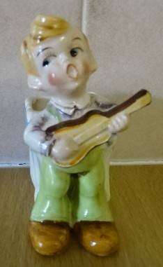CERAMIC BOY FIGURINE WITH BASKET (DATED 1952) HEIGHT 10CM