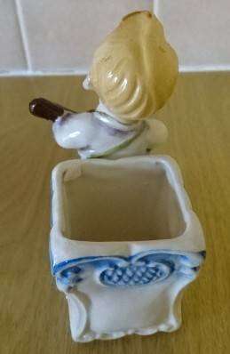 CERAMIC BOY FIGURINE WITH BASKET (DATED 1952) HEIGHT 10CM