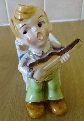 CERAMIC BOY FIGURINE WITH BASKET (DATED 1952) HEIGHT 10CM