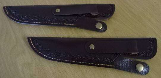 TWO DECORATIVE BROWN LEATHER-LIKE KNIFE SHEATHS FEATURING AN EMBOSSED DRAGON DESIGN (LENGHT 20 CM)