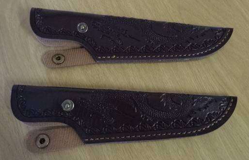 TWO DECORATIVE BROWN LEATHER-LIKE KNIFE SHEATHS FEATURING AN EMBOSSED DRAGON DESIGN (LENGHT 20 CM)
