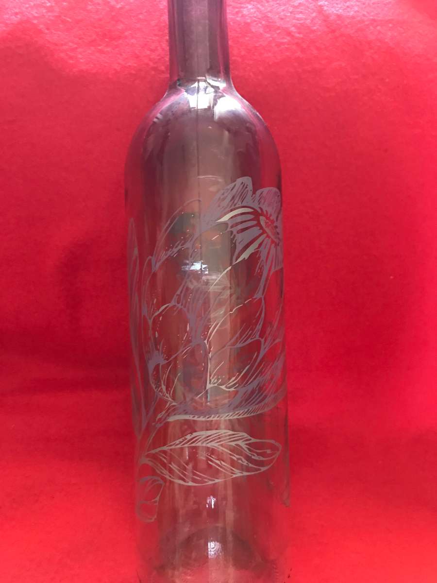 Protea painting on pink bottle