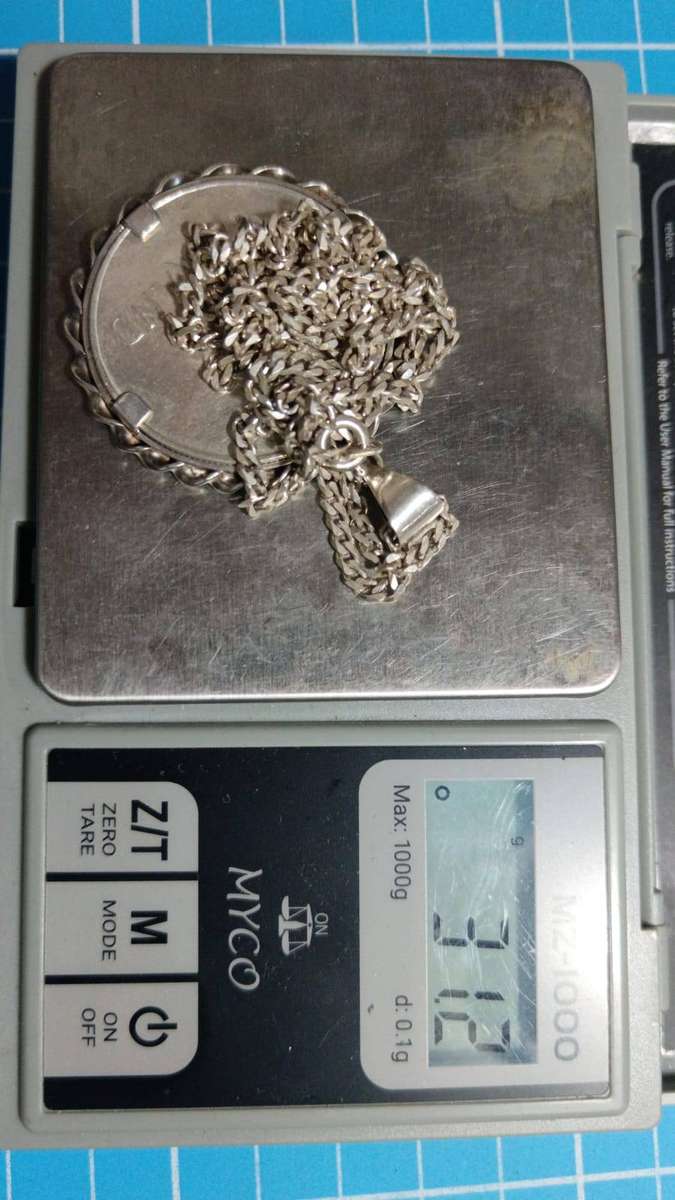 Silver R1 mounted on a silver chain