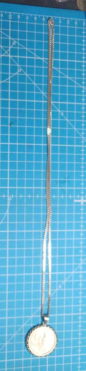 Silver R1 mounted on a silver chain