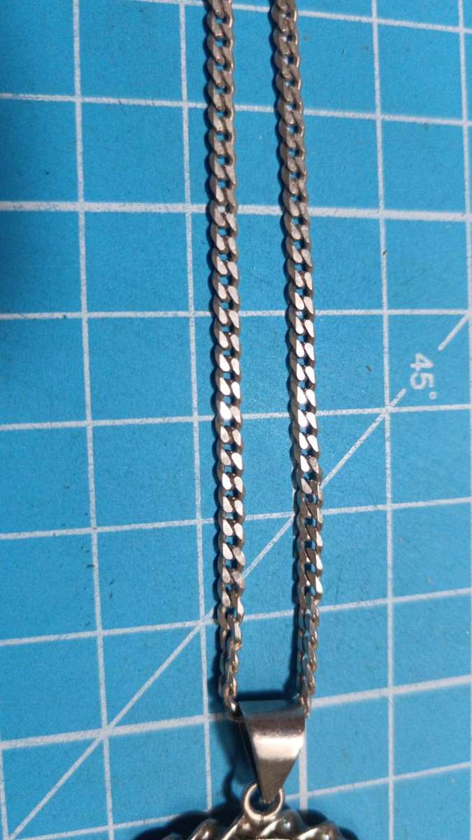 Silver R1 mounted on a silver chain