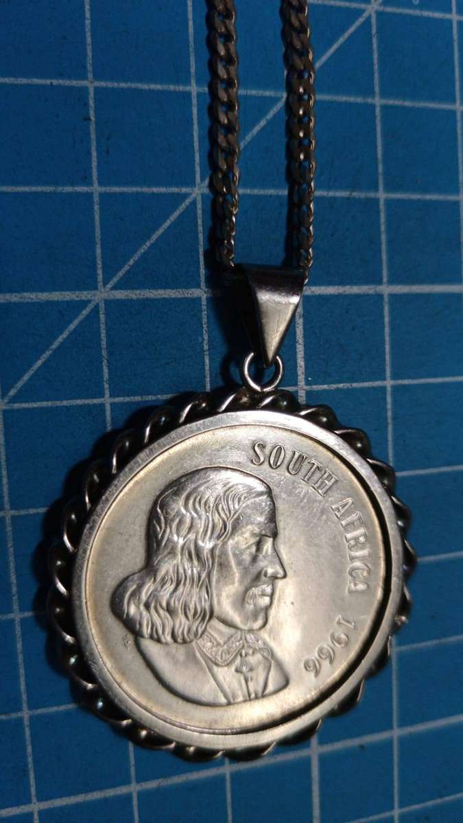 Silver R1 mounted on a silver chain