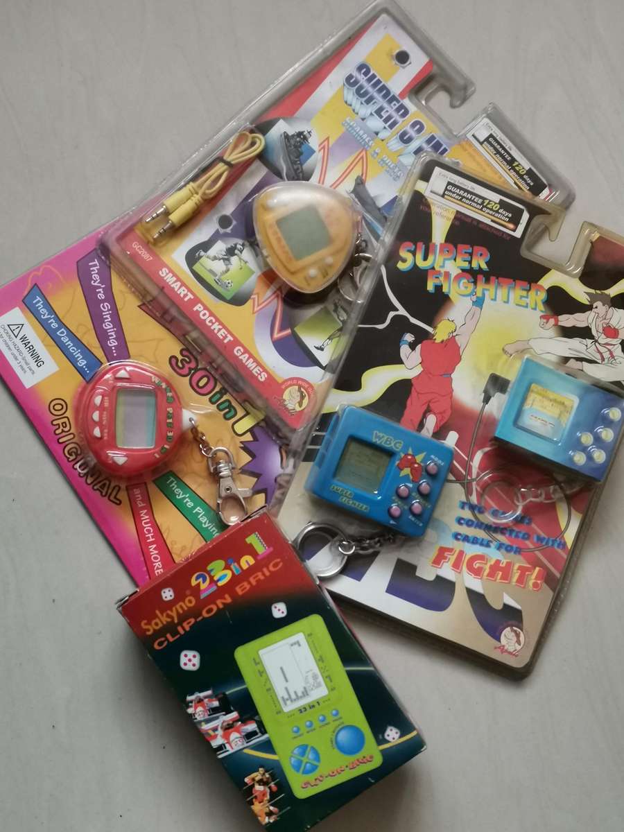 4 new old stock vintage handheld games