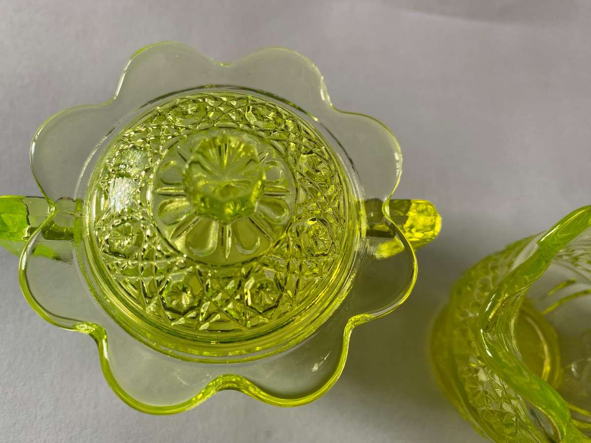 Vaseline glass creamer and sugar bowl with lid