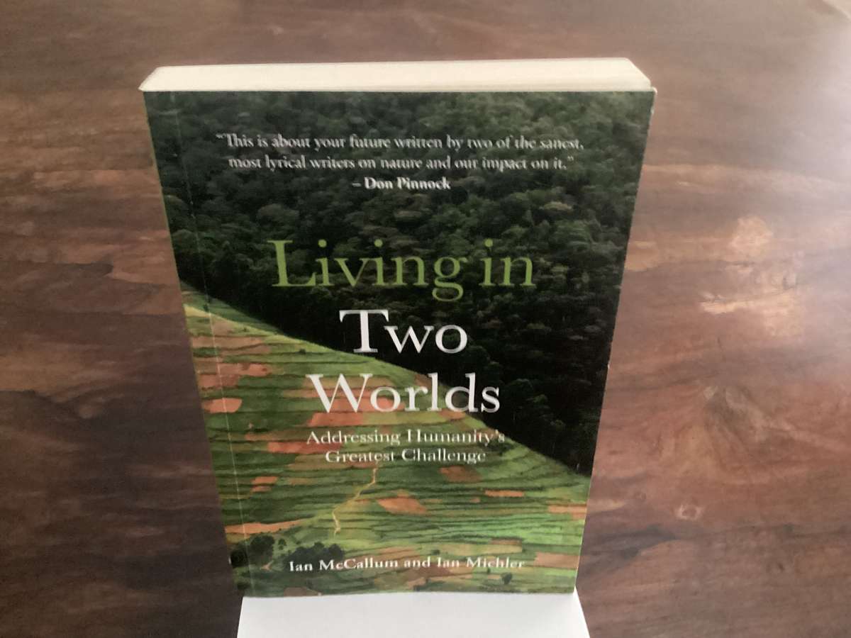 Living in Two Worlds, by Ian McCallum & Ian Michler. Trade Paperback in a VGood condition.