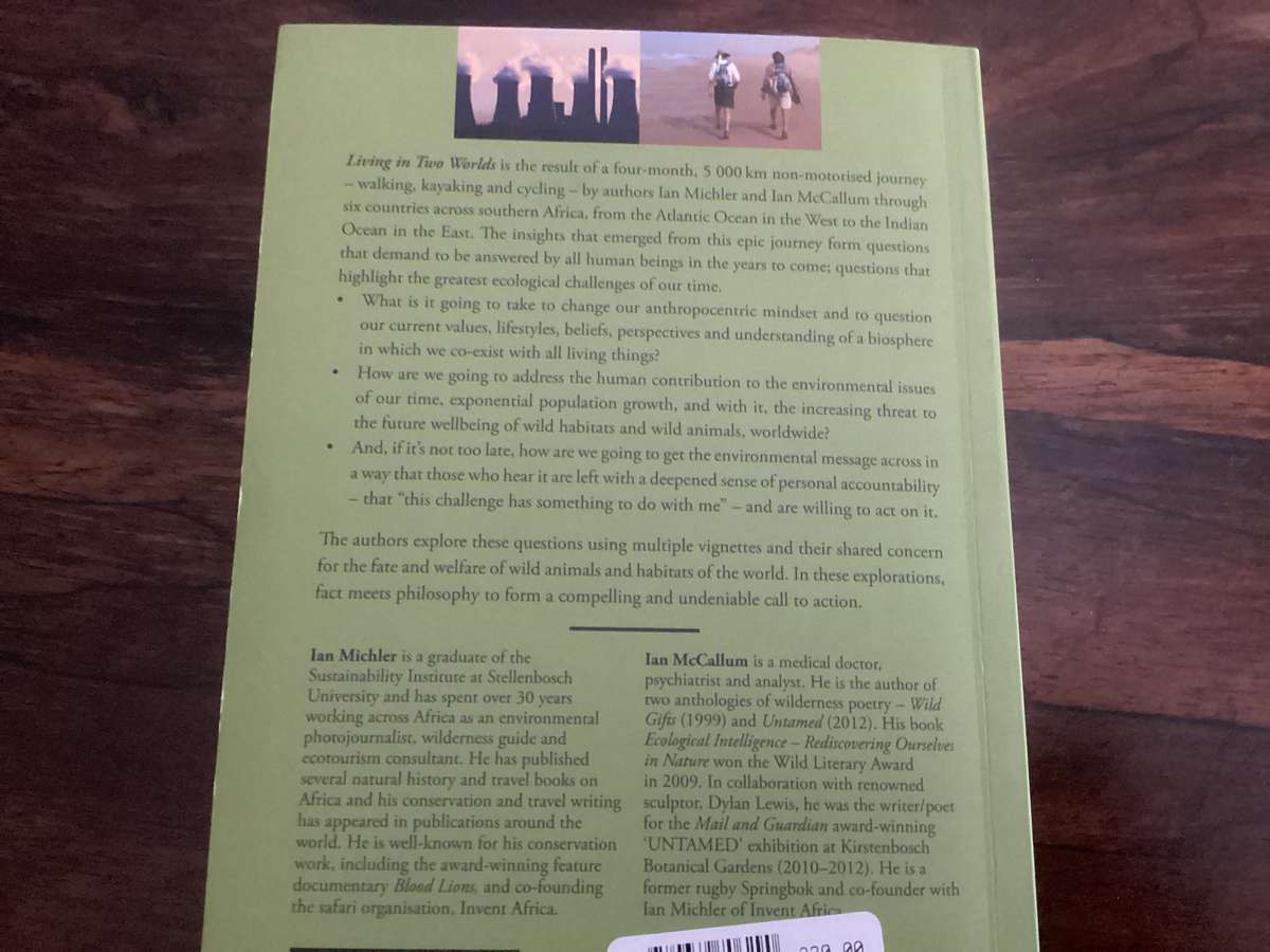 Living in Two Worlds, by Ian McCallum & Ian Michler. Trade Paperback in a VGood condition.