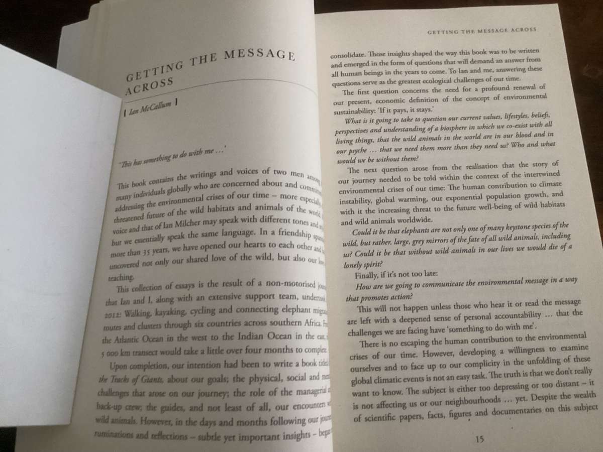 Living in Two Worlds, by Ian McCallum & Ian Michler. Trade Paperback in a VGood condition.