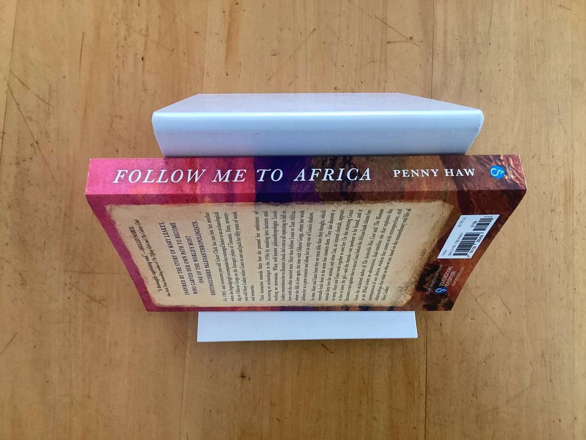 FOLLOW ME TO AFRICA. A novel by Penny Haw. Paperback in a new condition.