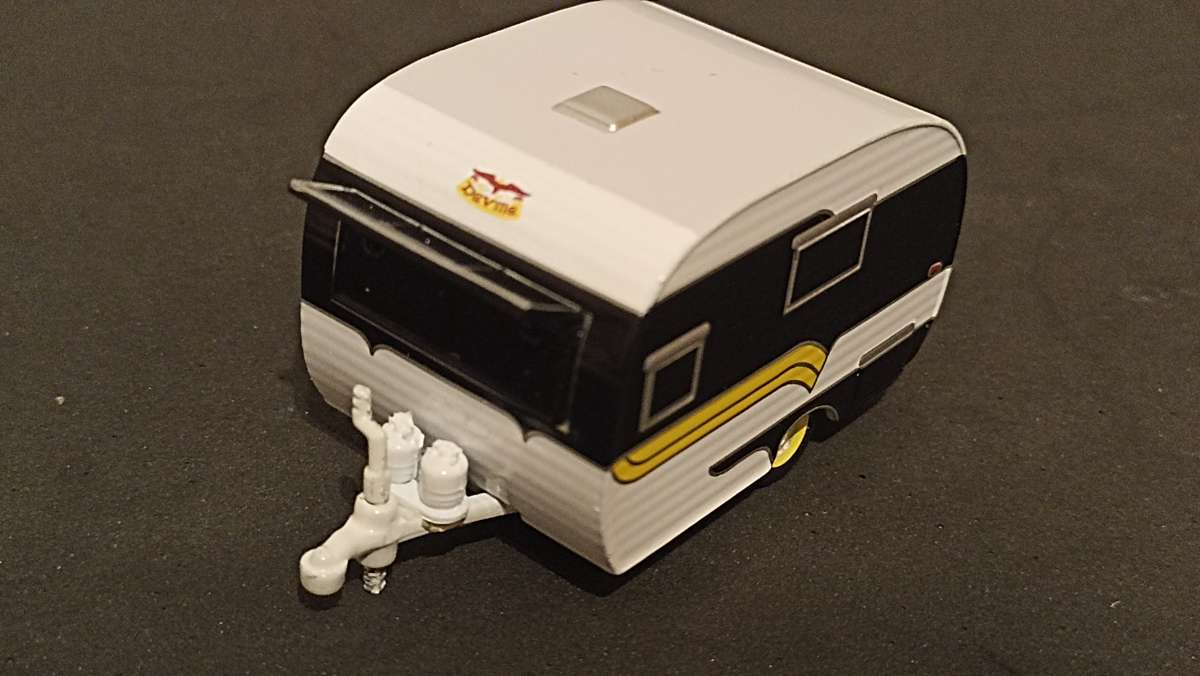 Two 1/64 scale caravans: Greenlight and Majorette
