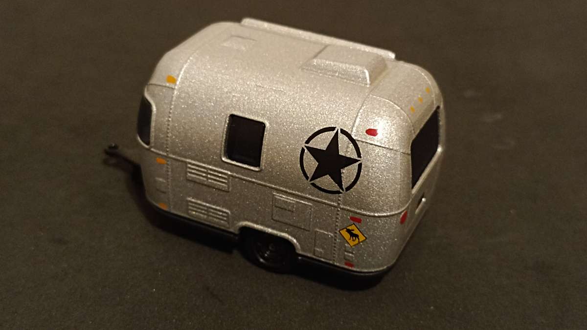 Two 1/64 scale caravans: Greenlight and Majorette