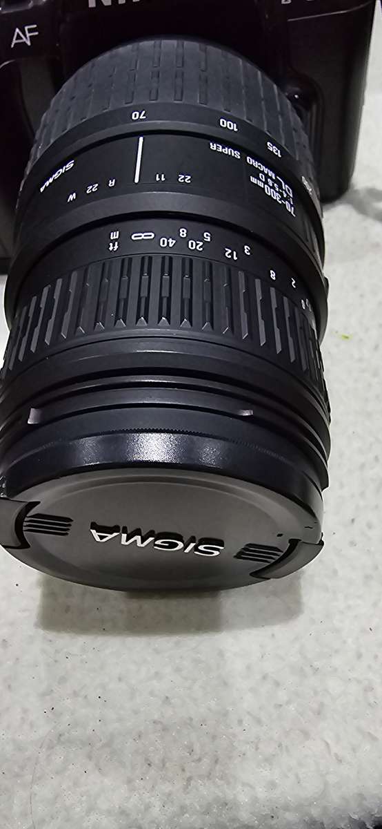 NIKON F601 CAMERA WITH LENS ,CASE AND A SPARE FILM ROLL