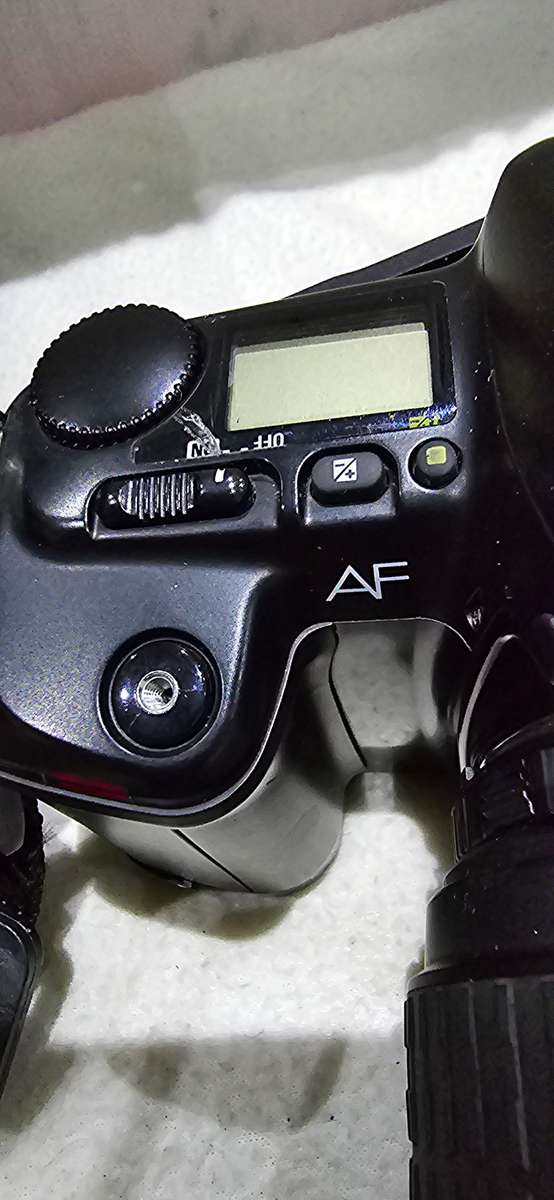 NIKON F601 CAMERA WITH LENS ,CASE AND A SPARE FILM ROLL