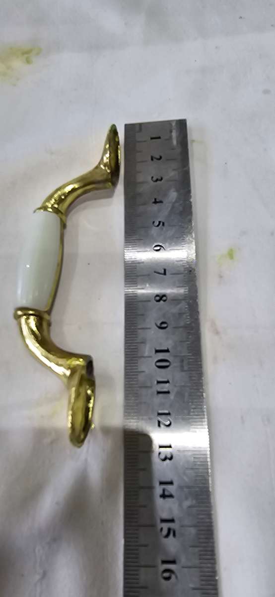 12 PIECE BRASS WITH WHITE FURNITURE HANDLES INCL.SCREWS