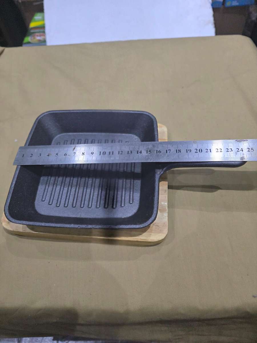 CAST IRON GRIDDLE PAN ON BOARD