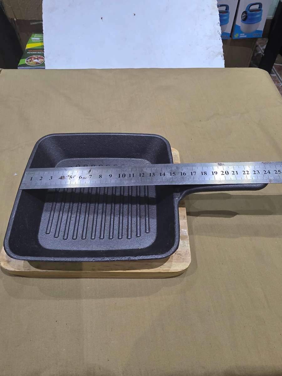 CAST IRON GRIDDLE PAN ON BOARD