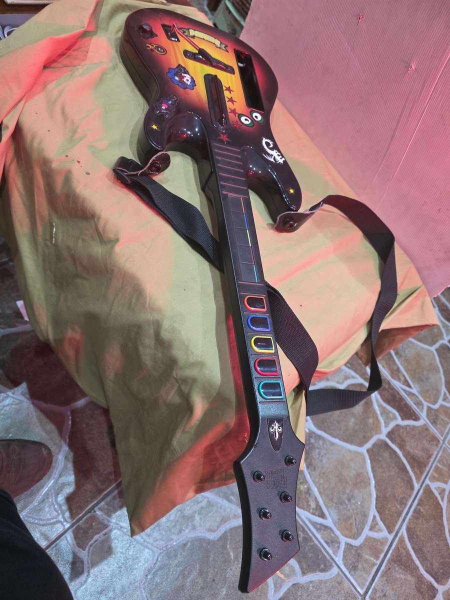 PLAYSTATION 2 GUITAR HERO PLUS 2 MICROPHONES AND 4 REMOTES