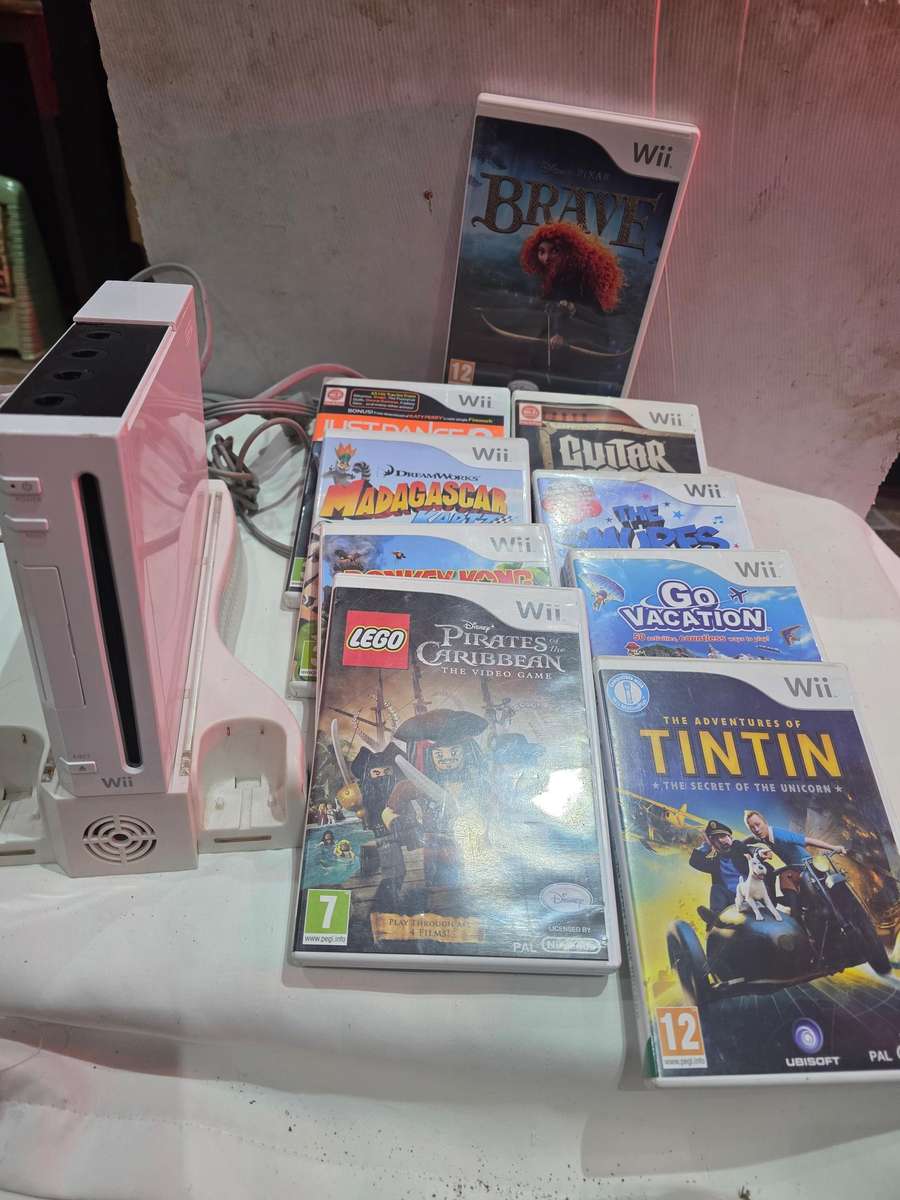 NINTENDO WII INCLUDES 9 GAME DISCS AND POWER SUPPLY