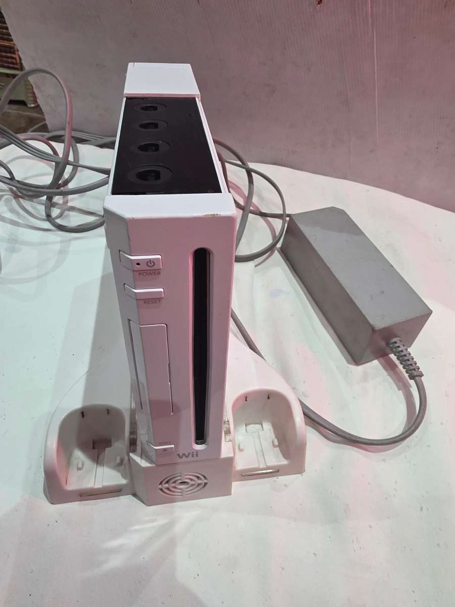 NINTENDO WII INCLUDES 9 GAME DISCS AND POWER SUPPLY