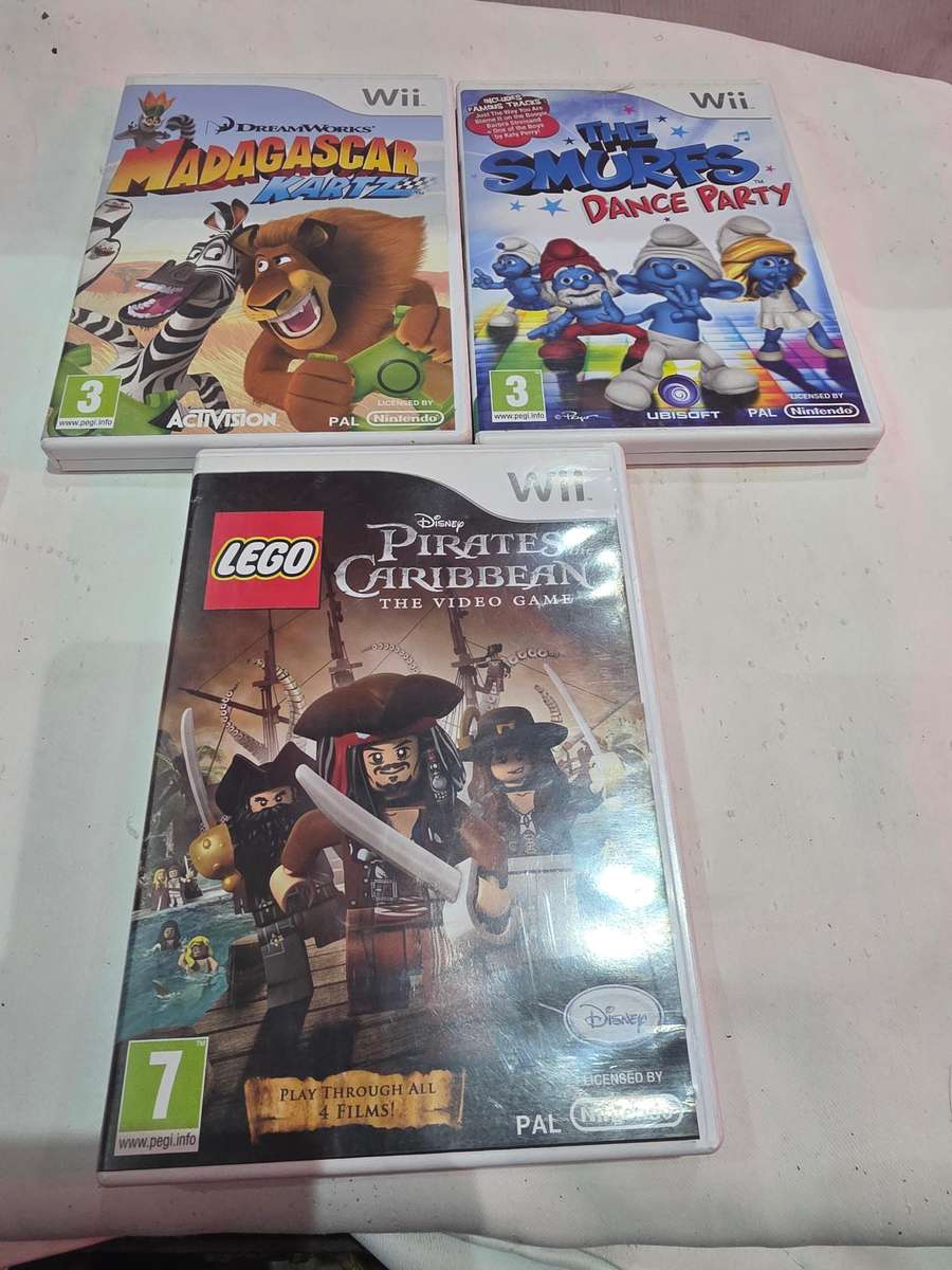 NINTENDO WII INCLUDES 9 GAME DISCS AND POWER SUPPLY