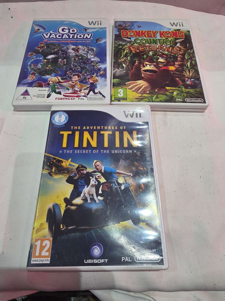 NINTENDO WII INCLUDES 9 GAME DISCS AND POWER SUPPLY