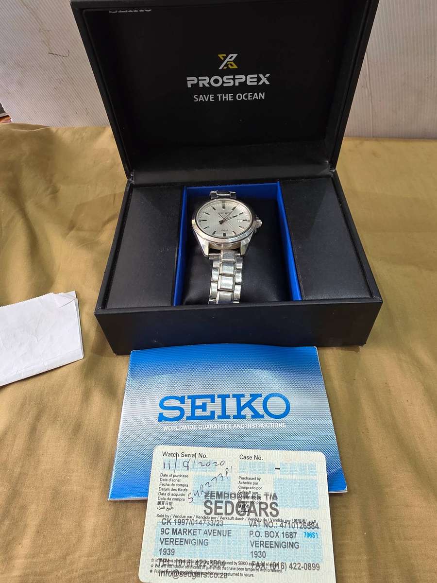 SEIKO MENS WRISTWATCH(ANALOGUE QUARTZ)WITH AUNTHETIC BOOKLET