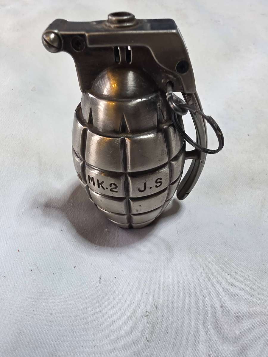 SOME SORT HAND GRENADE METAL ITEM( CIGARETTE LIGHTER?)