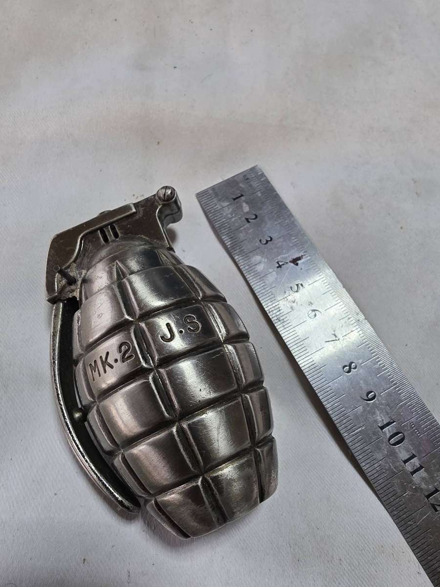 SOME SORT HAND GRENADE METAL ITEM( CIGARETTE LIGHTER?)