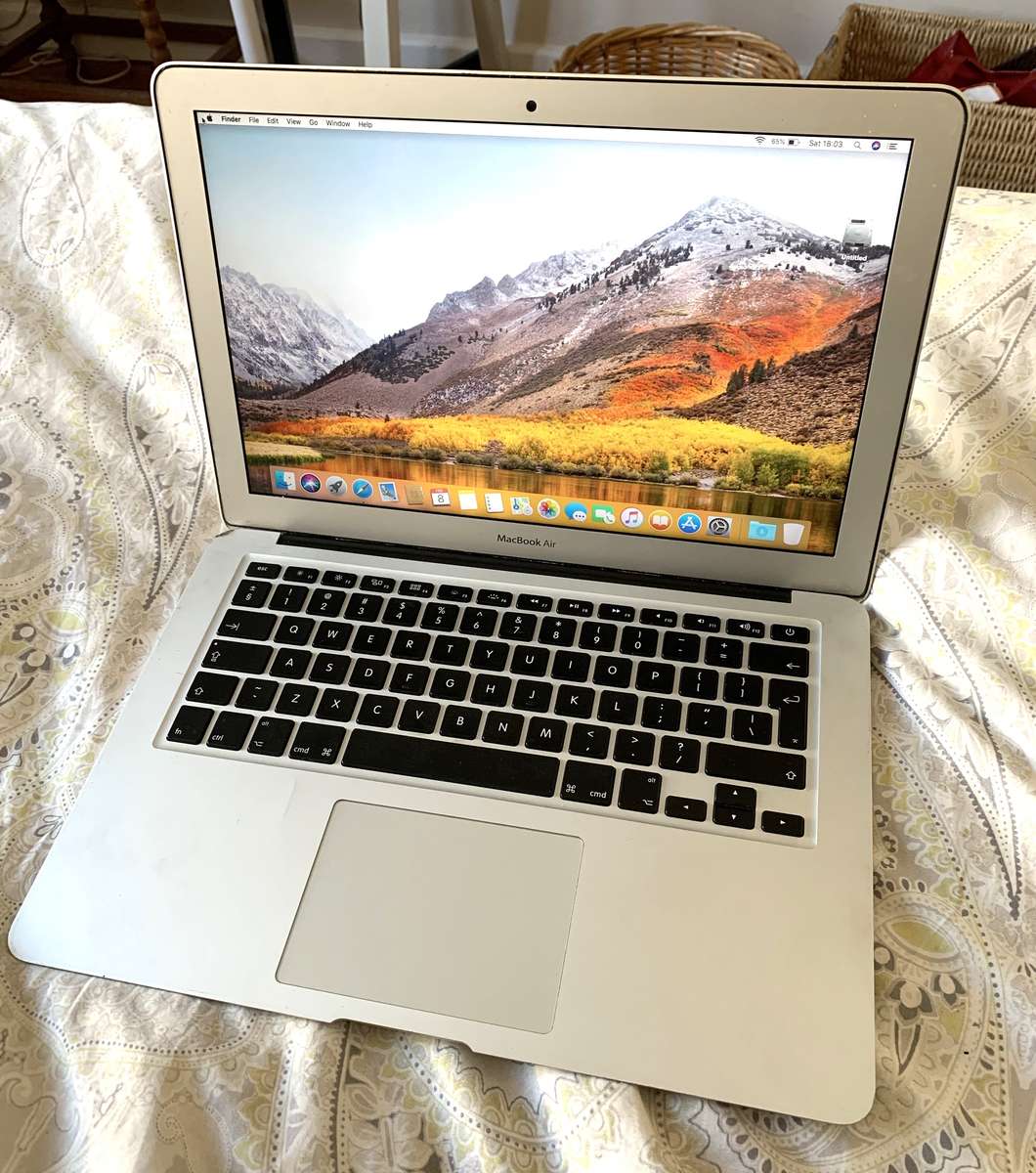 MacBook Air 13" running macOS High Sierra with charger, works 100%