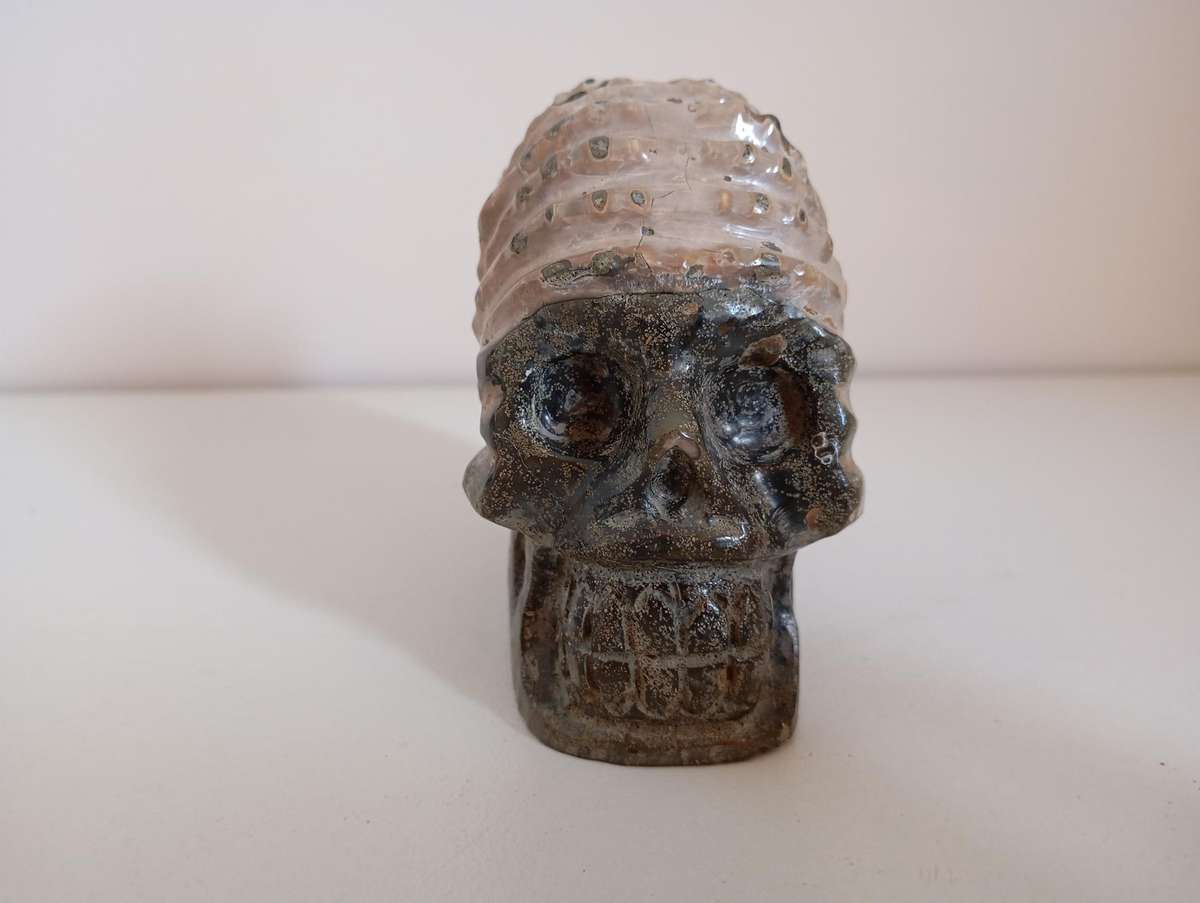 Ammonite with Skull Carving