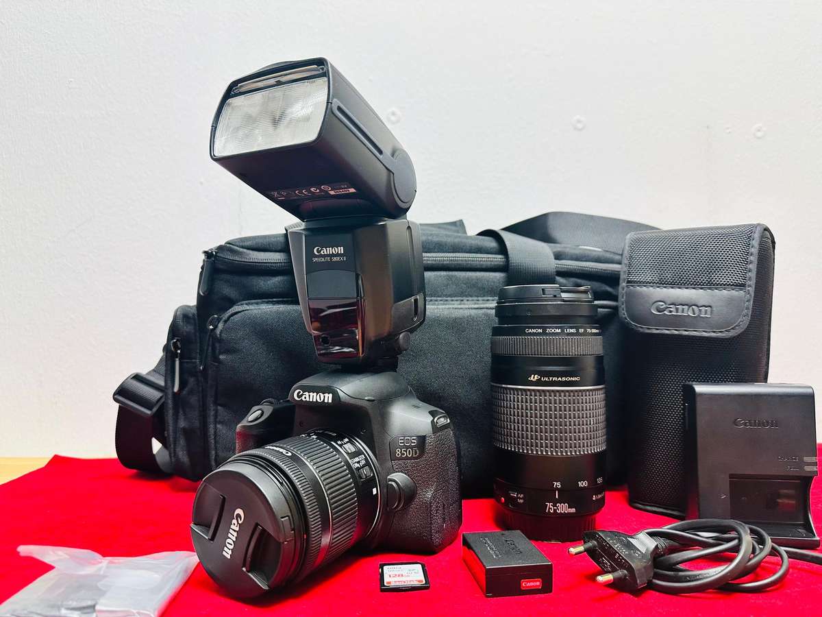 Canon EOS 850D with canon 2x lens and flash light & accessories