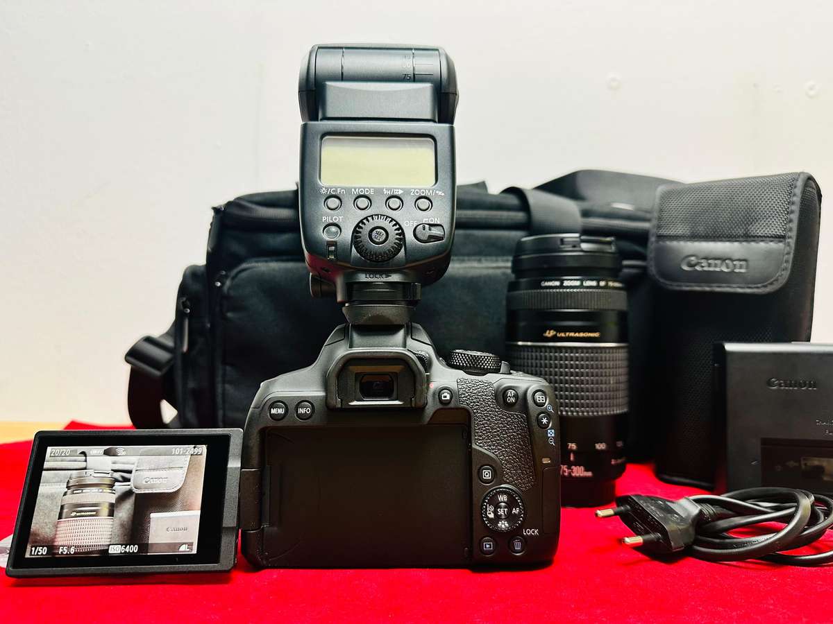 Canon EOS 850D with canon 2x lens and flash light & accessories