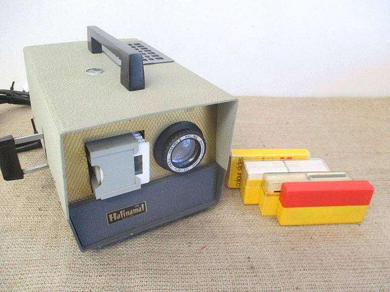 Vintage Halinamat 300 Slide Projector With An Attached Carousel And A Number Of Slides