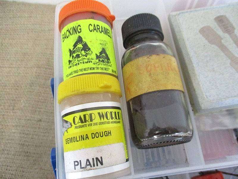 A Plastic Toolbox With A Variety Of Various Fishing Tackle Equipment