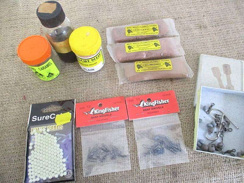 A Plastic Toolbox With A Variety Of Various Fishing Tackle Equipment