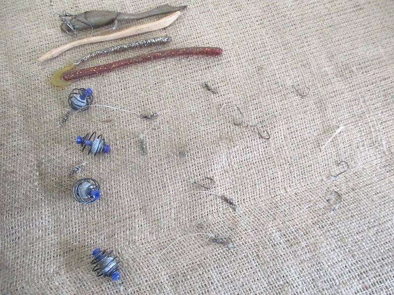 A Plastic Toolbox With A Variety Of Various Fishing Tackle Equipment