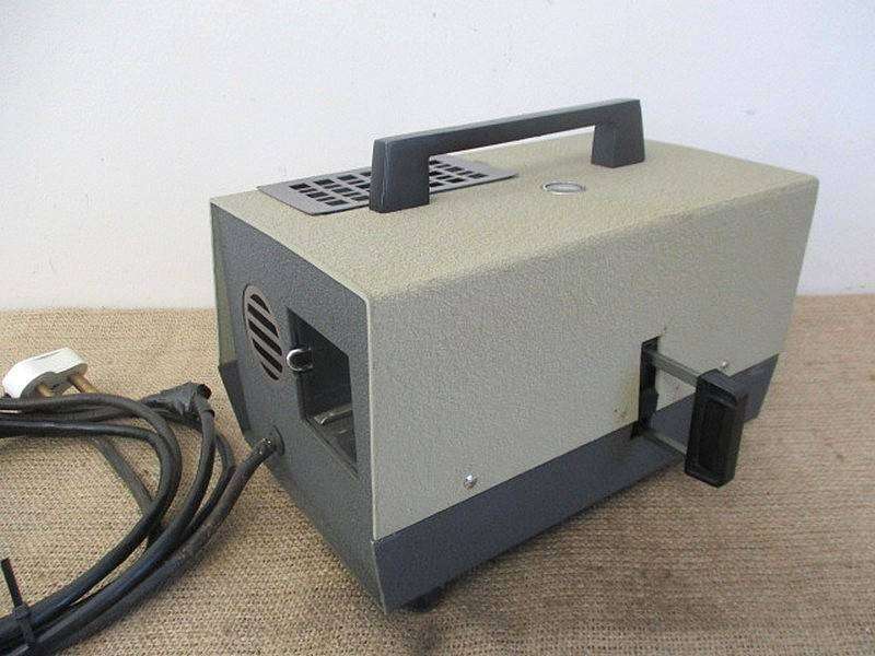 Vintage Halinamat 300 Slide Projector With An Attached Carousel And A Number Of Slides