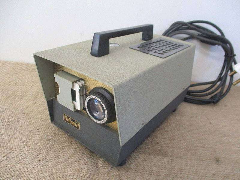 Vintage Halinamat 300 Slide Projector With An Attached Carousel And A Number Of Slides