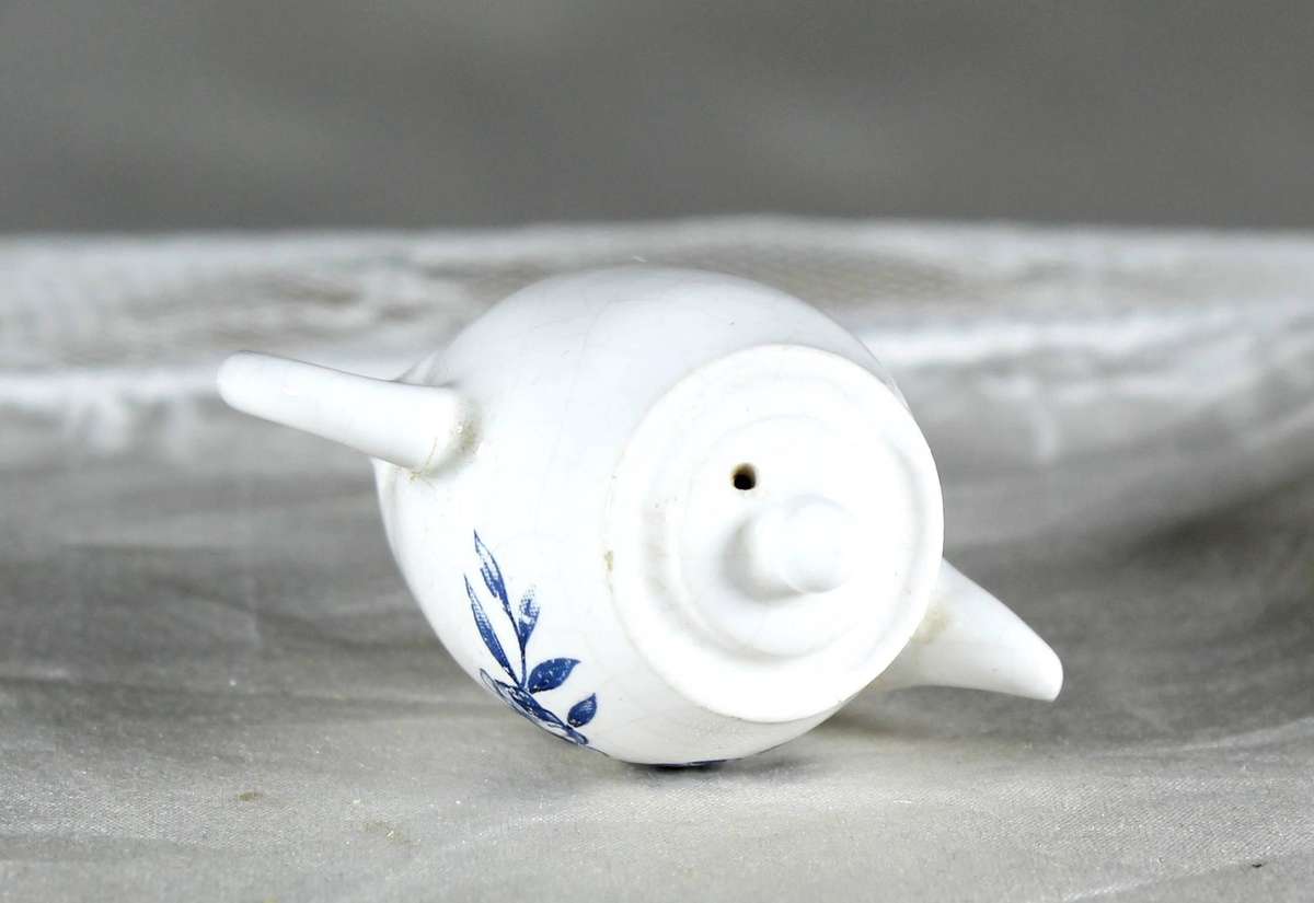Miniature porcelain kettle with flowers