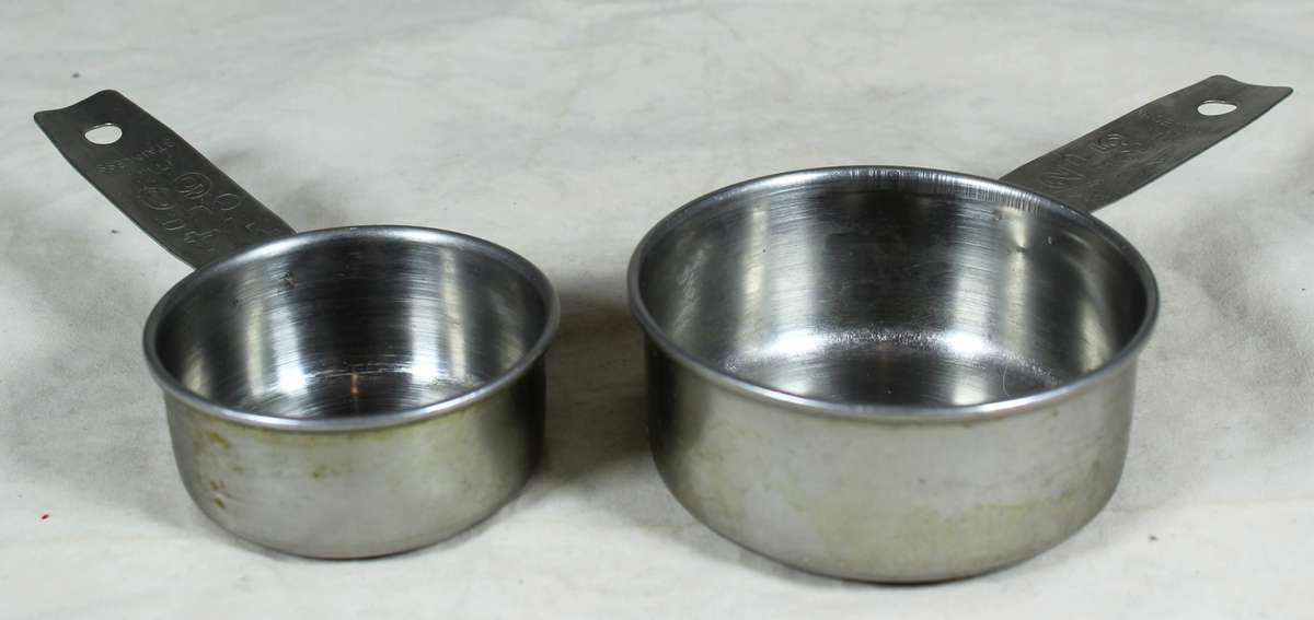 Pair of stainless steel measuring cups
