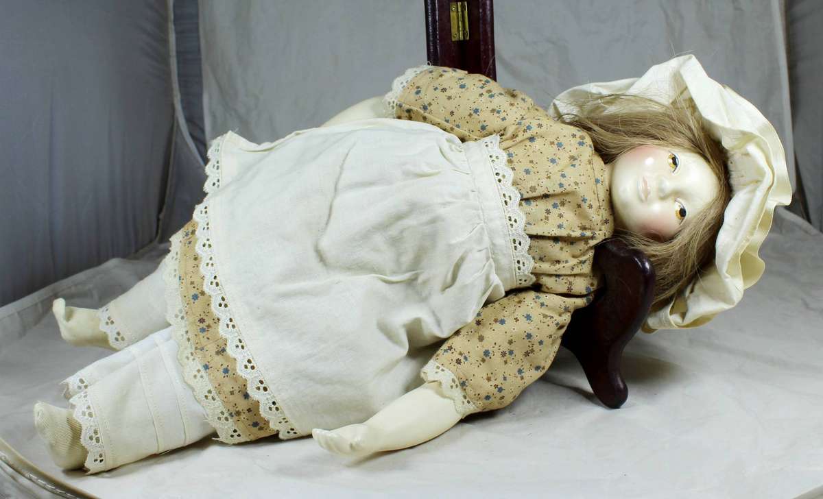 Vintage porcelain doll dressed in a period dress