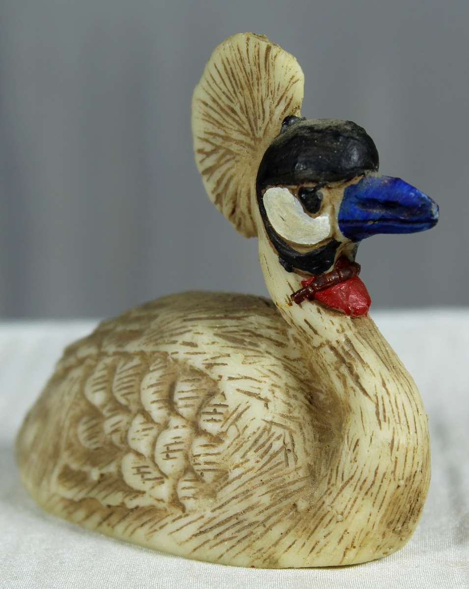 Miniature grey crowned crane figurine