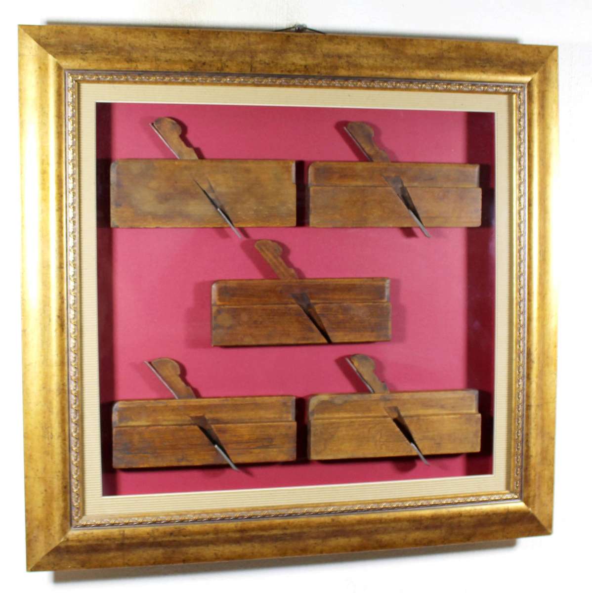 Antique wooden planes for moldings in a frame